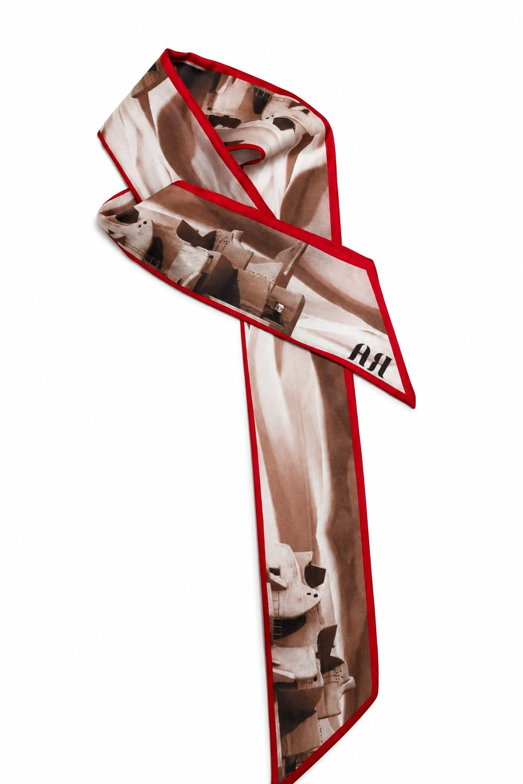 A silk scarf with a red border, featuring a sepia-toned graphic print of a stormtrooper from Star Wars, with the letters 'AA' printed on one end.
